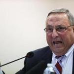 FILE - In this October 2015 file photo, Republican Gov. Paul LePage speaks at a town hall meeting in Auburn, Maine. The governor's intervention to get Democratic Speaker of the House Mark Eves fired from his job at a charter school roiled the Statehouse, led to a lawsuit and cast a cloud over the upcoming legislative session. The drama that pitted LePage against Eves was voted top story of the year by The Associated Press and its member affiliates in Maine. (AP Photo/Robert F. Bukaty, File)